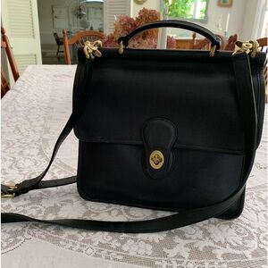 Vintage black leather coach satchel.